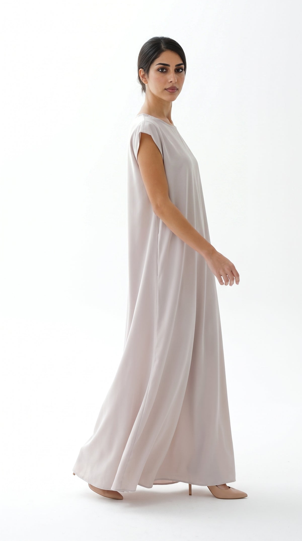 Nude Nida under abaya dress, side view