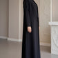 Sunburst black pleated abaya in Barbie Cobra showing the radiating pleat detail, third view