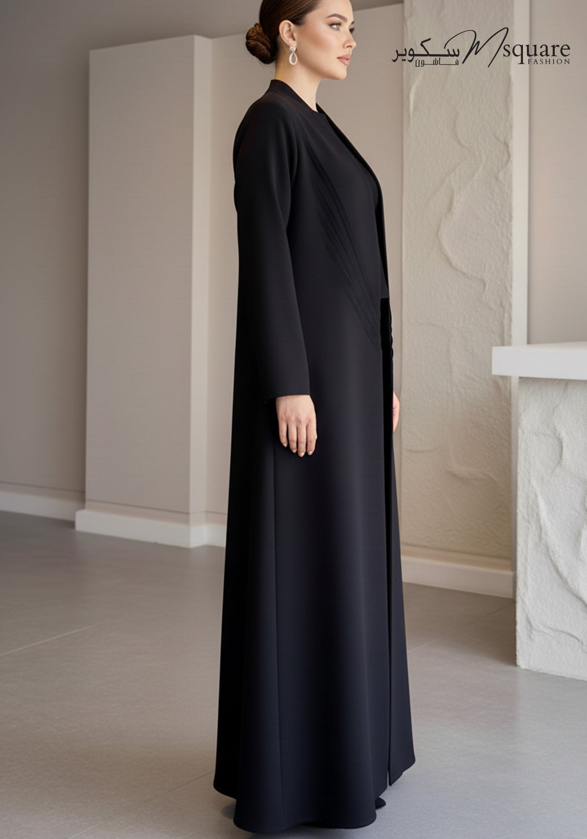 Sunburst black pleated abaya in Barbie Cobra showing the radiating pleat detail, third view